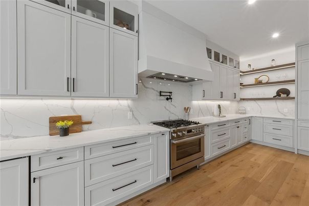 Interior, Kitchen, Marble Walls, Recessed Lighting, Stainless Steel Appliances, Wood Texture Flooring