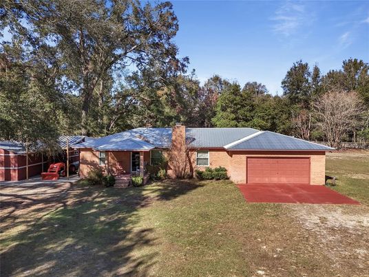 Attached, Backyard, Exterior, Facade, Brick Facade, None