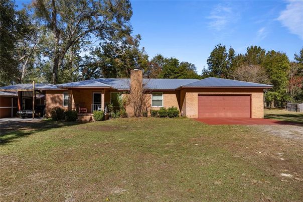 Attached, Backyard, Exterior, Facade, Brick Facade, Ranch