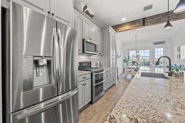 Chandelier, Dining room, Interior, Kitchen, Pendant Lights, Recessed Lighting, Stainless Steel Appliances, Wood Texture Flooring