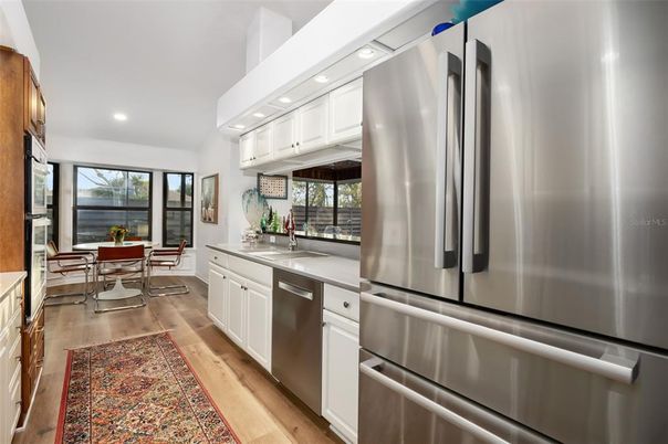 Dining room, Interior, Kitchen, Recessed Lighting, Stainless Steel Appliances, Wood Texture Flooring