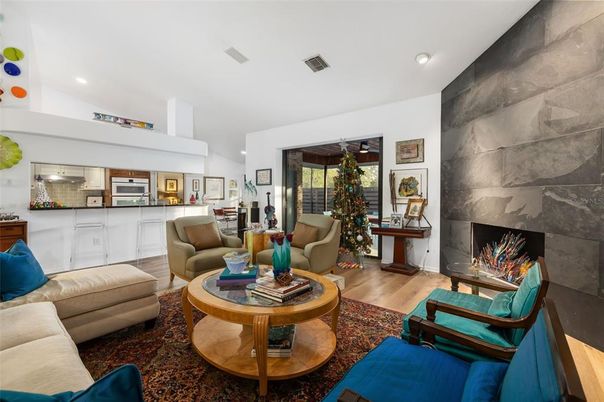 Fireplace, Interior, Kitchen, Living room, Recessed Lighting, Stainless Steel Appliances, Wood Texture Flooring