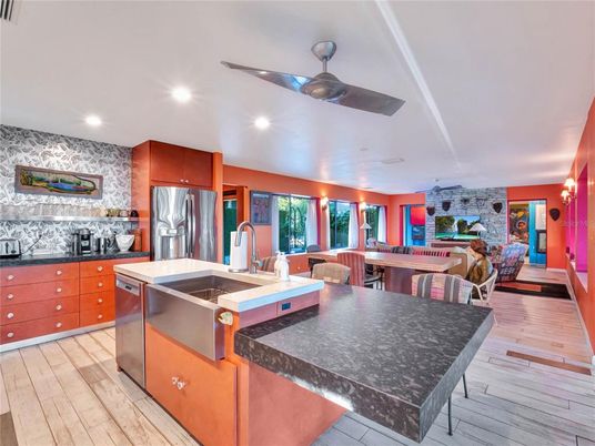 Dining room, Interior, Kitchen, Recessed Lighting, Stainless Steel Appliances, Stone Walls, Wood Texture Flooring