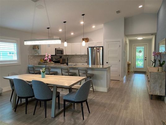 Dining room, Interior, Kitchen, Pendant Lights, Recessed Lighting, Stainless Steel Appliances, Wood Texture Flooring