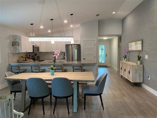 Dining room, Interior, Kitchen, Pendant Lights, Recessed Lighting, Stainless Steel Appliances, Wood Texture Flooring