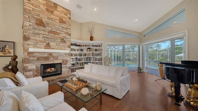 Fireplace, Interior, Living room, Piano, Recessed Lighting, Stone Walls, Wood Texture Flooring