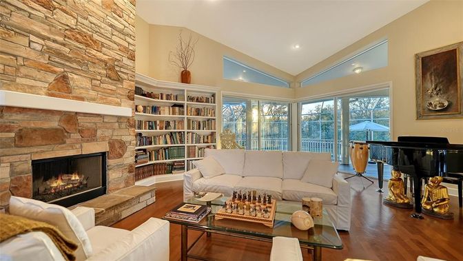 Fireplace, Interior, Living room, Piano, Recessed Lighting, Stone Walls, Wood Texture Flooring