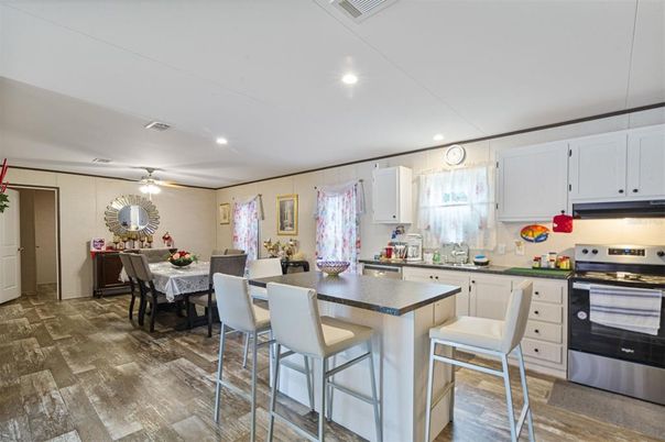 Dining room, Interior, Kitchen, Recessed Lighting, Stainless Steel Appliances, Wood Texture Flooring
