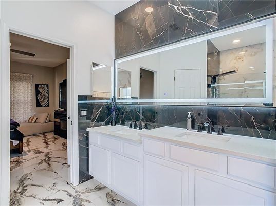 Bathroom, Dual Sink Vanities, Interior, Marble, Marble Walls, Recessed Lighting
