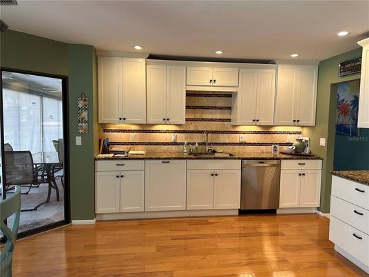 Dining room, Interior, Kitchen, Recessed Lighting, Stainless Steel Appliances, Wood Texture Flooring
