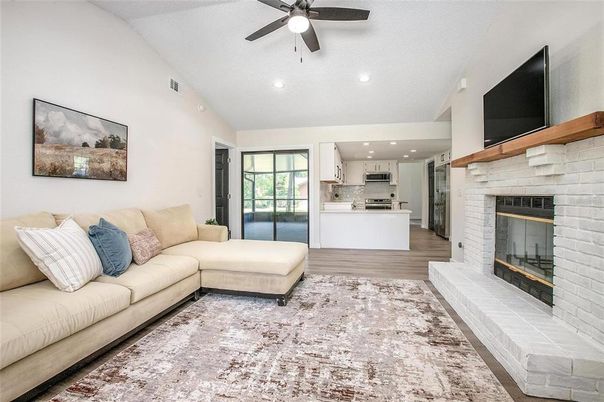Fireplace, Interior, Kitchen, Living room, Recessed Lighting, Stainless Steel Appliances, Stone Walls, Wood Texture Flooring