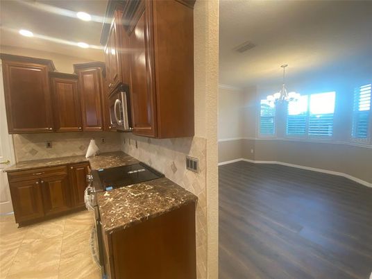 Chandelier, Fireplace, Interior, Kitchen, Recessed Lighting, Wood Texture Flooring
