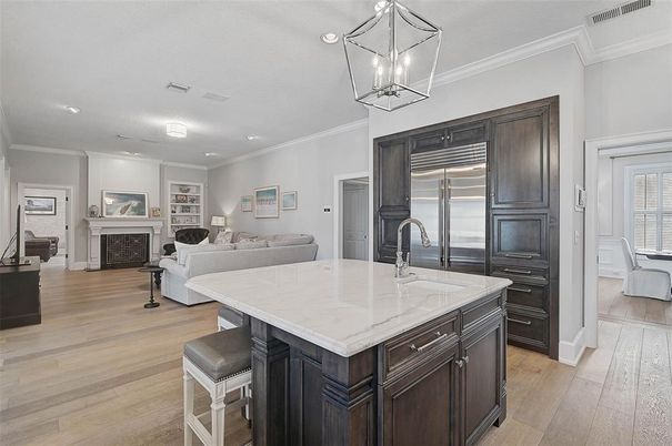 Fireplace, Interior, Kitchen, Living room, Pendant Lights, Recessed Lighting, Stainless Steel Appliances, Wood Texture Flooring