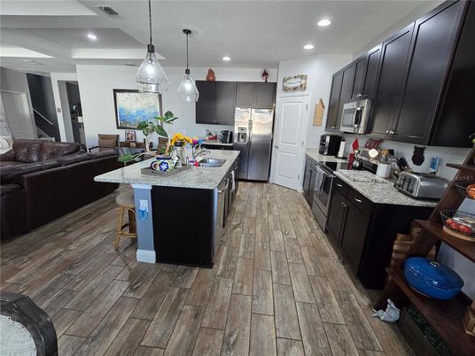 Interior, Kitchen, Pendant Lights, Recessed Lighting, Stainless Steel Appliances, Wood Texture Flooring