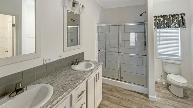 Bathroom, Dual Sink Vanities, Glass Shower, Interior, Wood Texture Flooring