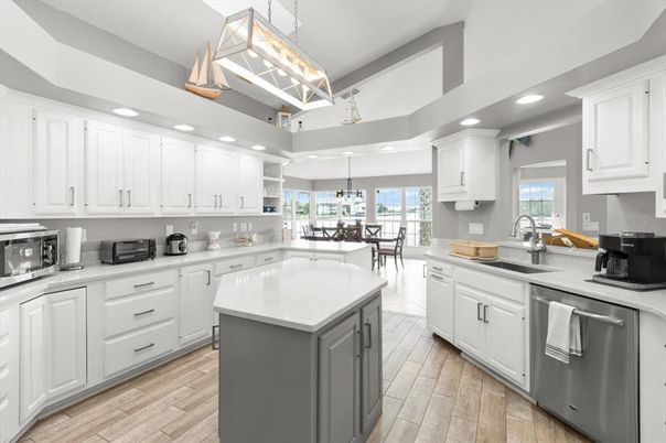 Chandelier, Dining room, Interior, Kitchen, Pendant Lights, Recessed Lighting, Stainless Steel Appliances, Wood Texture Flooring
