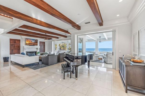Fireplace, Interior, Living room, Piano, Recessed Lighting, Water, Wooden Beams