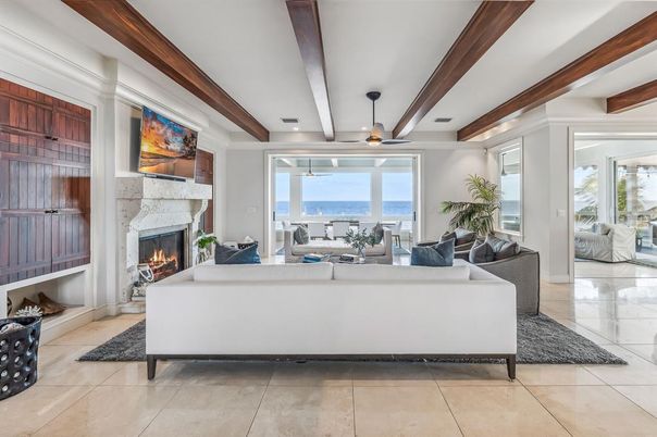 Fireplace, Interior, Living room, Recessed Lighting, Water, Wooden Beams