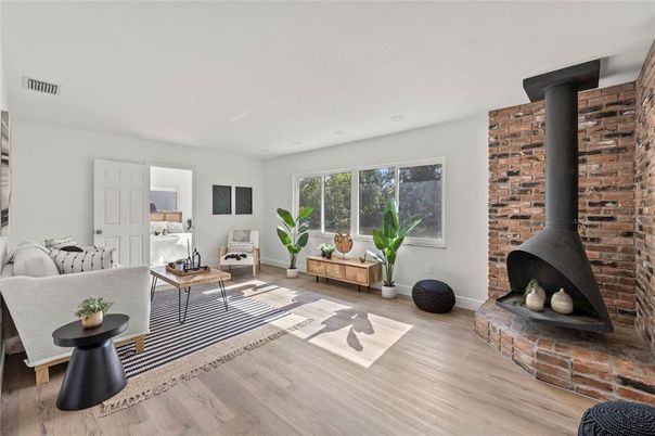 Fireplace, Interior, Living room, Recessed Lighting, Stone Walls, Wood Texture Flooring