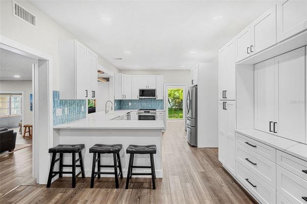 Interior, Kitchen, Recessed Lighting, Stainless Steel Appliances, Wood Texture Flooring