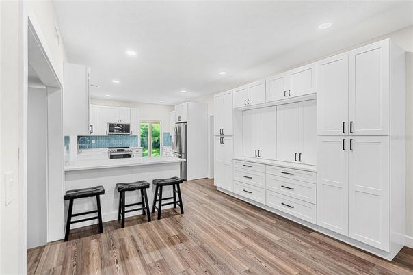 Interior, Kitchen, Recessed Lighting, Stainless Steel Appliances, Wood Texture Flooring