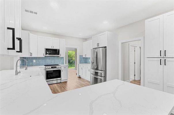 Interior, Kitchen, Recessed Lighting, Stainless Steel Appliances, Wood Texture Flooring