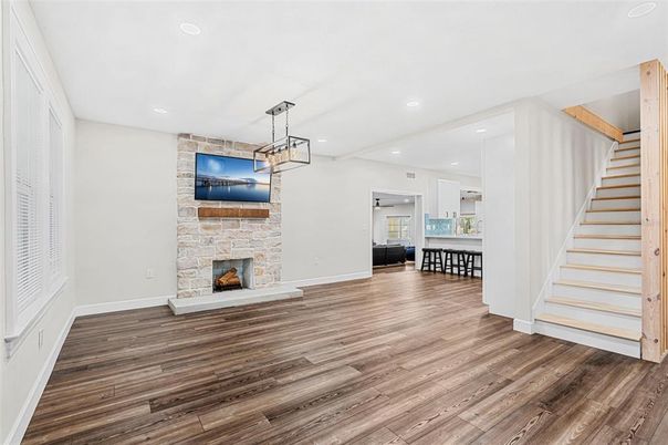 Empty room, Fireplace, Interior, Kitchen, Pendant Lights, Recessed Lighting, Wood Texture Flooring