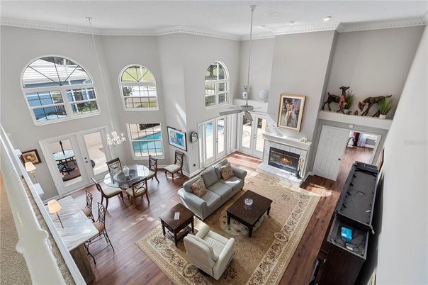 Dining room, Fireplace, Interior, Living room, Recessed Lighting, Wood Texture Flooring