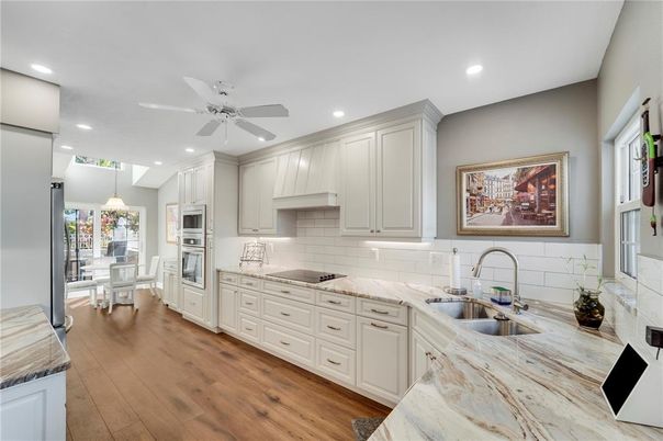 Dining room, Interior, Kitchen, Pendant Lights, Recessed Lighting, Stainless Steel Appliances, Wood Texture Flooring