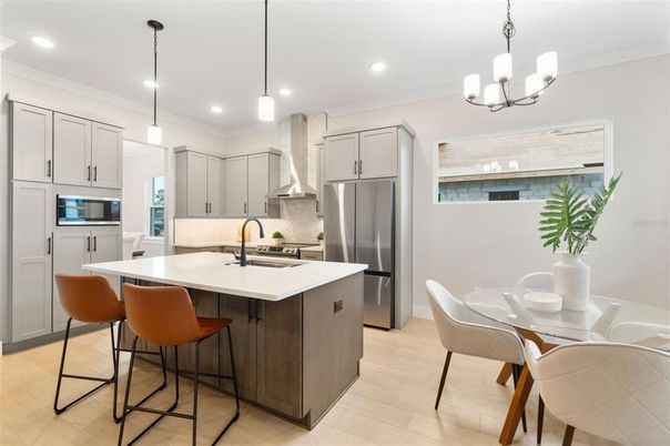Dining room, Interior, Kitchen, Pendant Lights, Recessed Lighting, Stainless Steel Appliances, Wood Texture Flooring