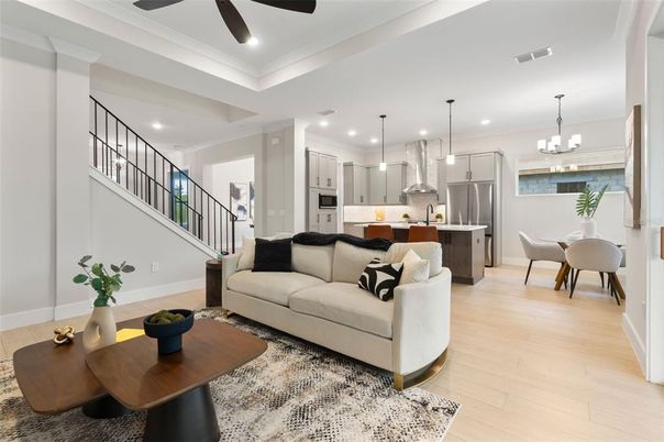 Chandelier, Dining room, Interior, Kitchen, Living room, Pendant Lights, Recessed Lighting, Stainless Steel Appliances, Wood Texture Flooring