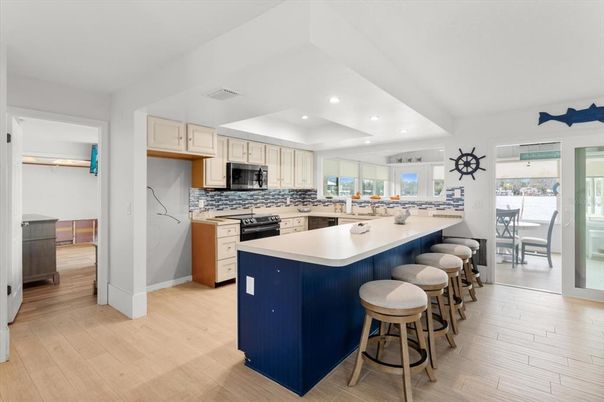 Dining room, Interior, Kitchen, Recessed Lighting, Stainless Steel Appliances, Wood Texture Flooring