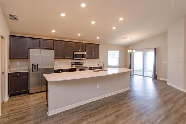 Chandelier, Interior, Kitchen, Recessed Lighting, Stainless Steel Appliances, Wood Texture Flooring