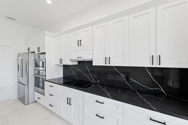 Interior, Kitchen, Marble Walls, Recessed Lighting, Stainless Steel Appliances