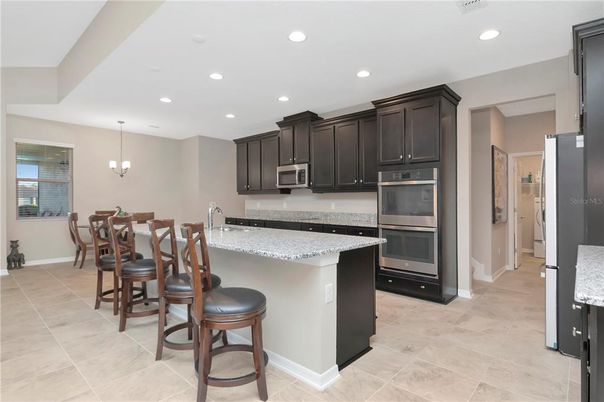 Chandelier, Dining room, Interior, Kitchen, Pendant Lights, Recessed Lighting, Stainless Steel Appliances