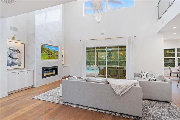 Fireplace, Interior, Living room, Marble Walls, Pendant Lights, Recessed Lighting, Wood Texture Flooring