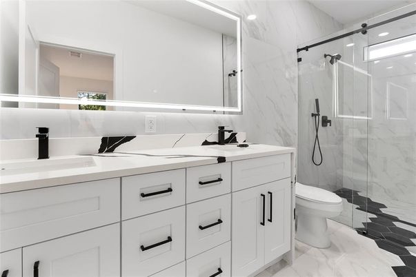 Bathroom, Dual Sink Vanities, Glass Shower, Interior, Marble, Marble Walls, Recessed Lighting
