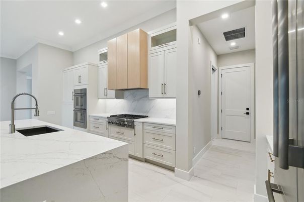 Interior, Kitchen, Marble Walls, Recessed Lighting, Stainless Steel Appliances