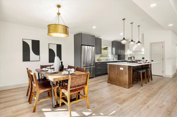 Dining room, Interior, Kitchen, Pendant Lights, Recessed Lighting, Stainless Steel Appliances, Wood Texture Flooring