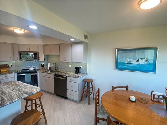 Dining room, Interior, Kitchen, Recessed Lighting, Stainless Steel Appliances, Wood Texture Flooring