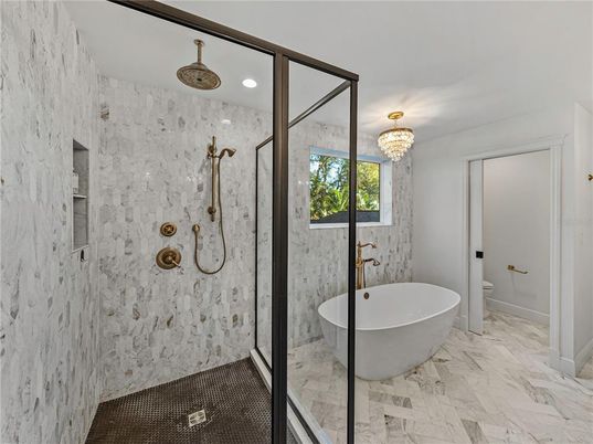 Bathroom, Chandelier, Free Standing Baths, Glass Shower, Interior, Marble, Marble Walls, Recessed Lighting