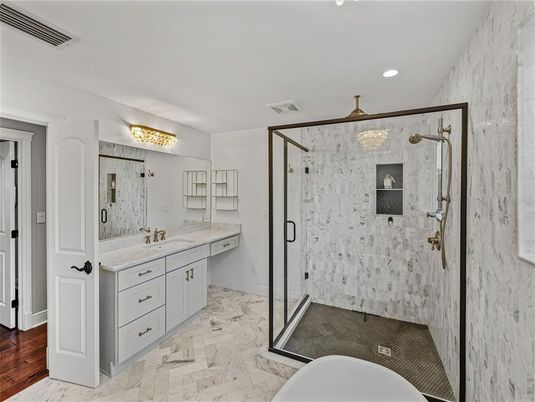 Bathroom, Dual Sink Vanities, Glass Shower, Interior, Marble, Marble Walls, Recessed Lighting, Wood Texture Flooring