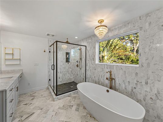 Bathroom, Chandelier, Free Standing Baths, Glass Shower, Interior, Marble, Marble Walls, Recessed Lighting