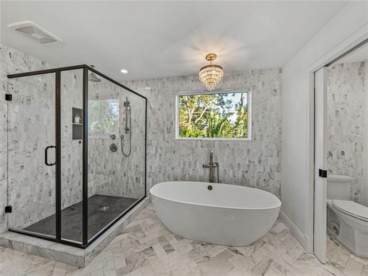 Bathroom, Chandelier, Free Standing Baths, Glass Shower, Interior, Marble, Marble Walls, Recessed Lighting