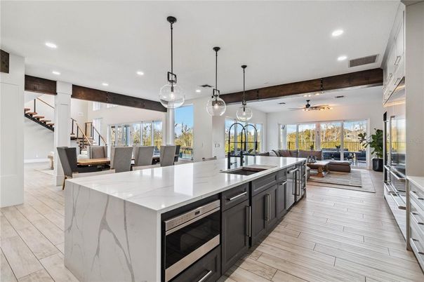Dining room, Interior, Kitchen, Living room, Pendant Lights, Recessed Lighting, Stainless Steel Appliances, Wood Texture Flooring