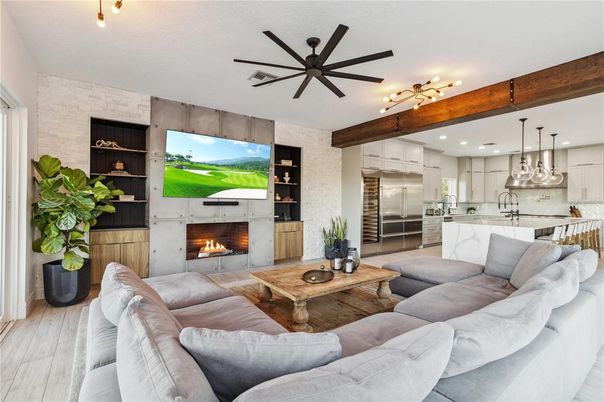 Fireplace, Interior, Kitchen, Living room, Pendant Lights, Recessed Lighting, Stainless Steel Appliances, Stone Walls, Wooden Beams, Wood Texture Flooring