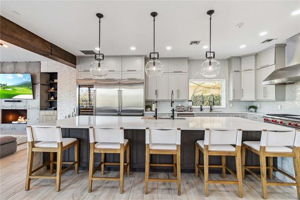 Fireplace, Interior, Kitchen, Pendant Lights, Recessed Lighting, Stainless Steel Appliances, Wooden Beams, Wood Texture Flooring