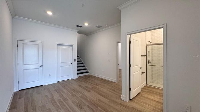 Bathroom, Empty room, Glass Shower, Interior, Recessed Lighting, Wood Texture Flooring