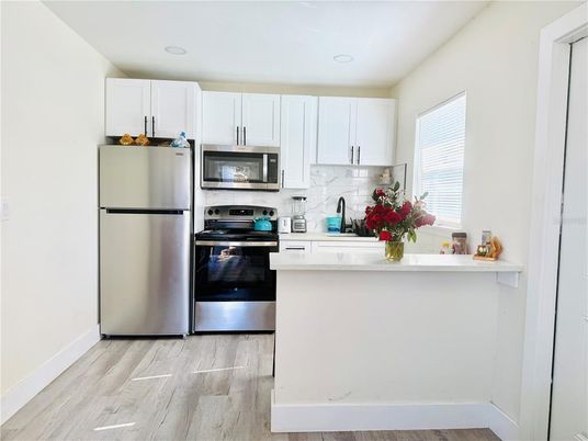 Interior, Kitchen, Recessed Lighting, Stainless Steel Appliances, Wood Texture Flooring