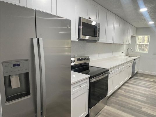 Interior, Kitchen, Recessed Lighting, Stainless Steel Appliances, Wood Texture Flooring